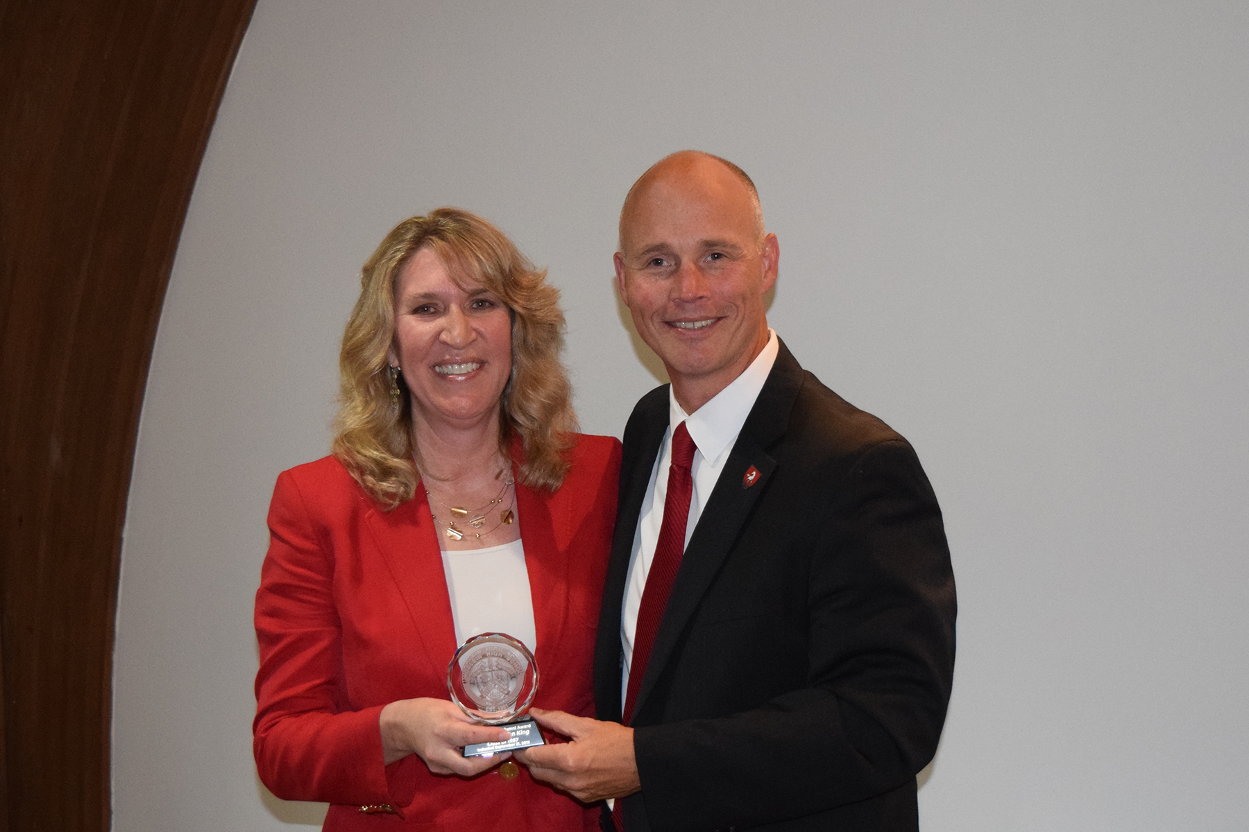 Dr. King receives her Distinguished Alumni Award from Superintendent Dr. Kevin Myers