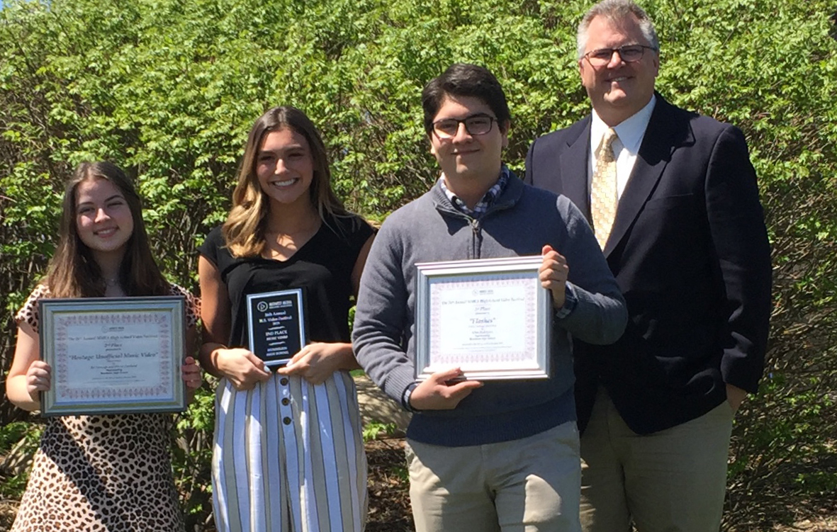 The award winners pose with their awards and with Mr. Meister