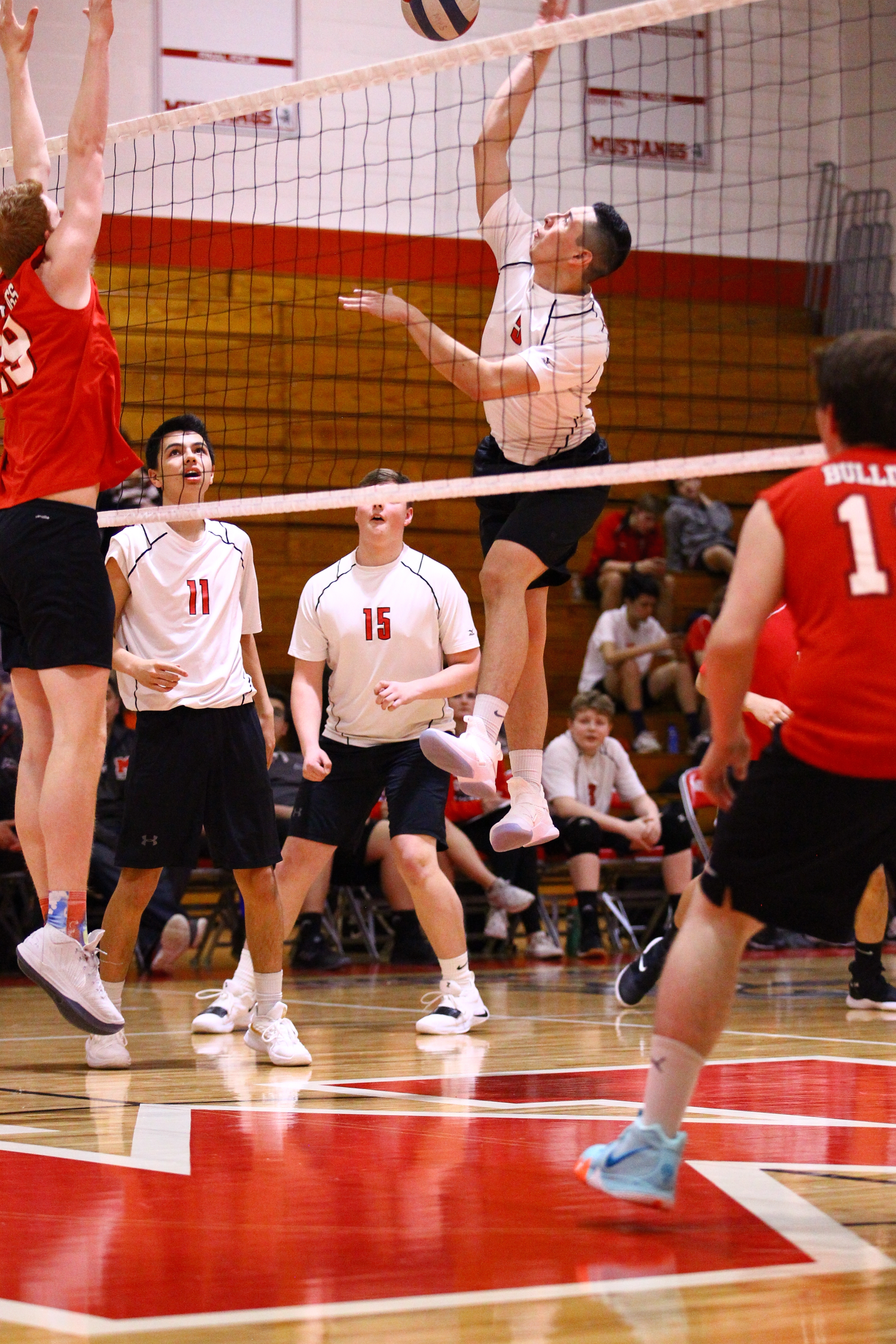 Action shot from a boys volleyball game